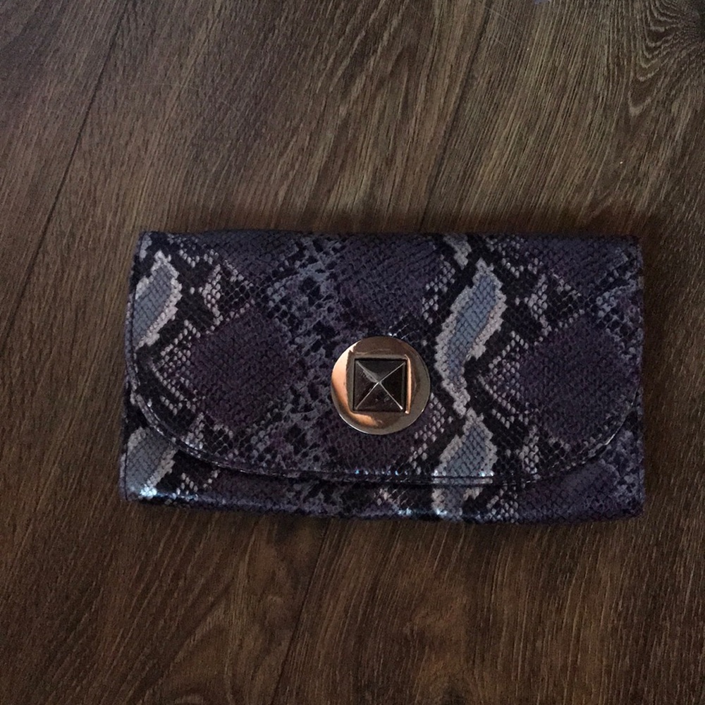 Purple snake skin clutch purse